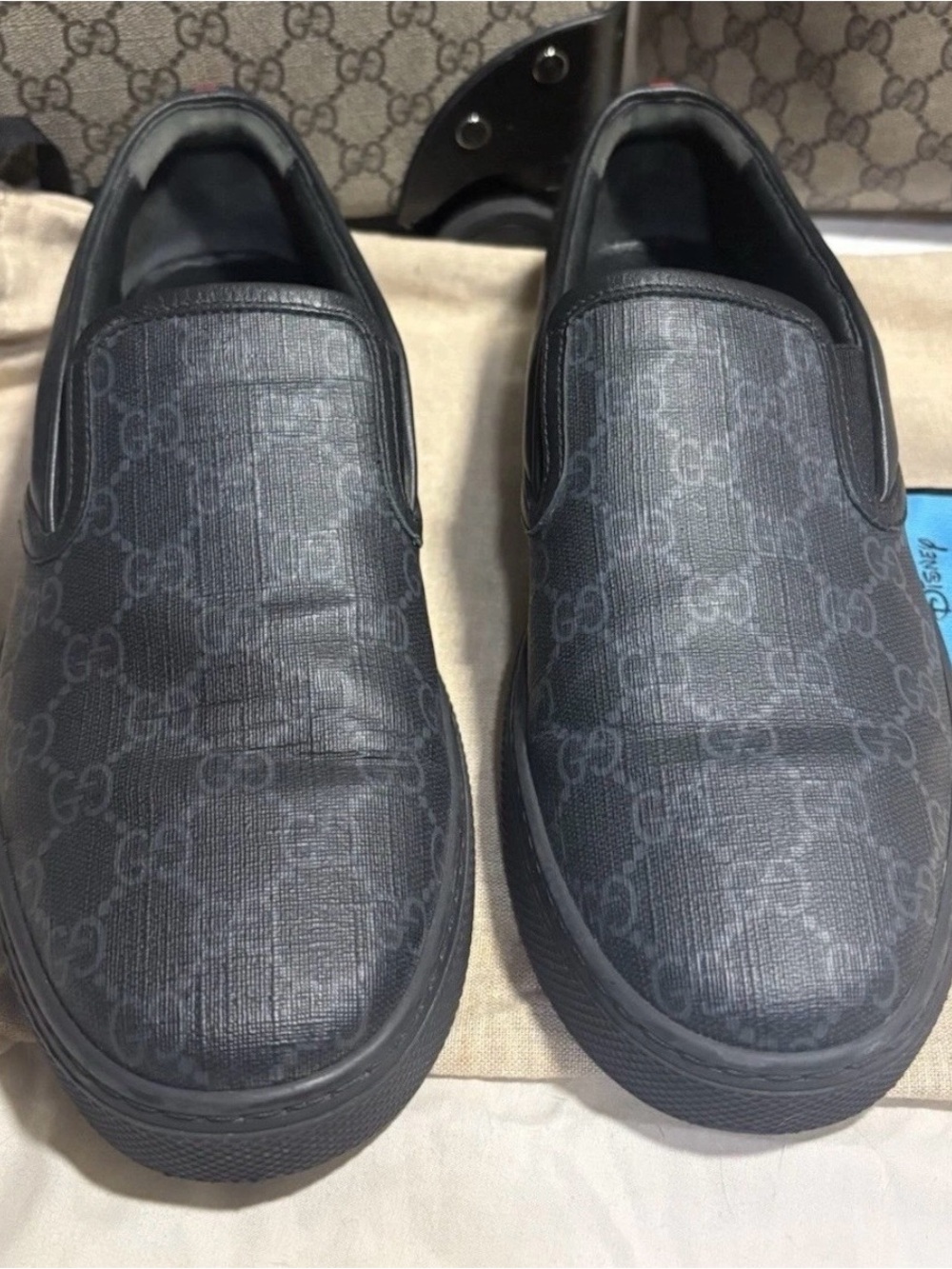 Gucci GG Supreme Slip-On Sneakers in black and grey canvas